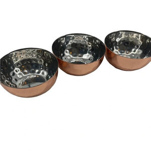 Three little copper colored hammered bowls